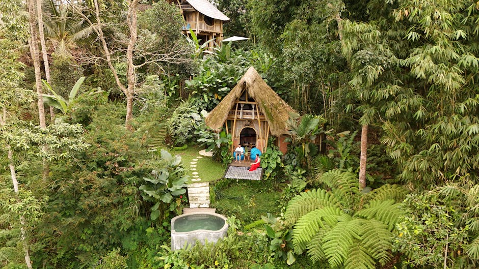 Aerial view of a bamboo hut nestled amidst lush greenery in Bali, Indonesia.