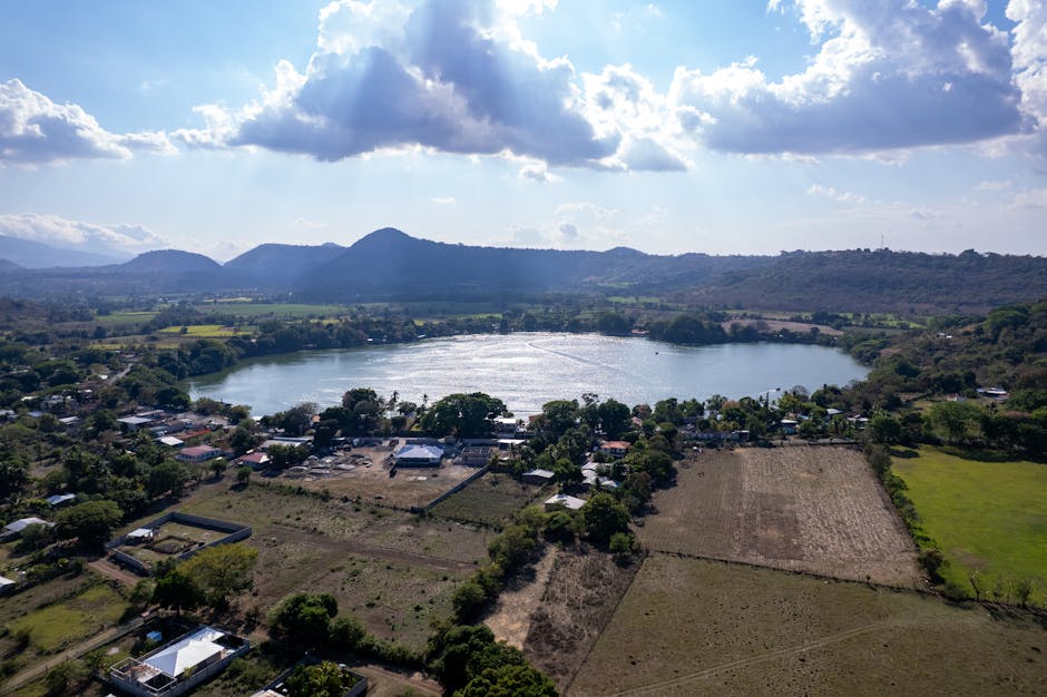 Scenic aerial view of Apastepeque Lake and surrounding landscape in San Vicente, El Salvador.