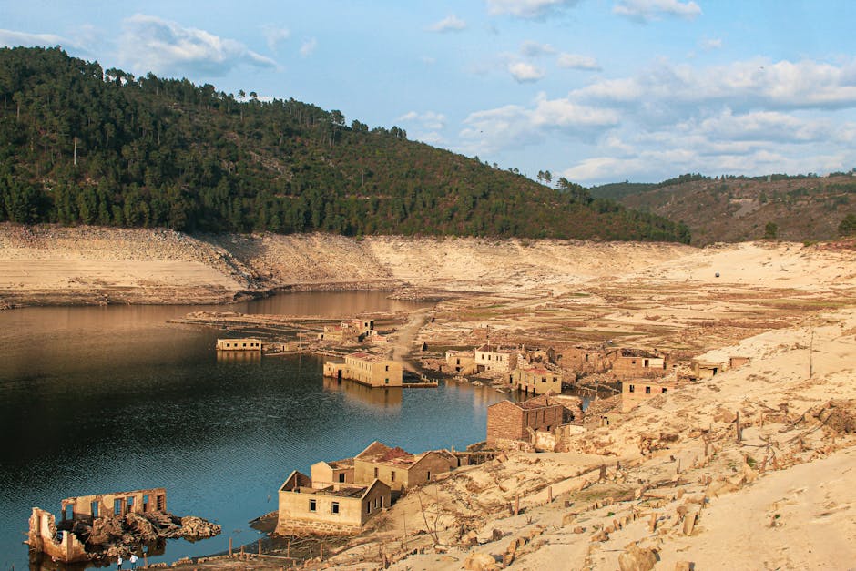 Aceredo, an abandoned village in Spain, submerged under a reservoir now visible due to drought.